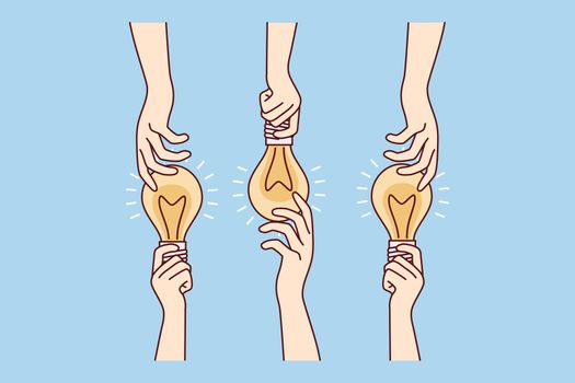 Hands sharing glowing light bulbs are metaphor for ideas or joint brainstorming. Vector image
