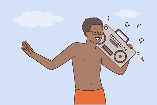 Happy black man enjoy music on stereo