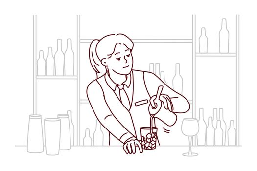 Female bartender making cocktail at bar