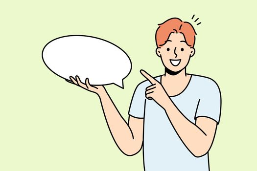 Smiling man point at mockup speech bubble