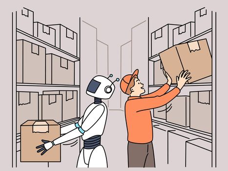 Robot helping male worker in warehouse