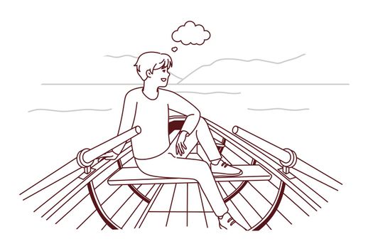 Happy man sit in boat dreaming