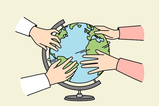 Diverse hands turning globe