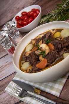 Beef bourguignon recipe, beef stew with wine sauce and vegetables
