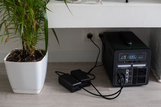 Charging station for gadgets when there is no light during blackout. Generator power bank battery in the absence of electricity. Charge electric rechargeable battery
