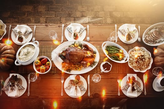 Its a feast thats bound to impress everyone. High angle shot of a dining table all laid out for Thanksgiving.