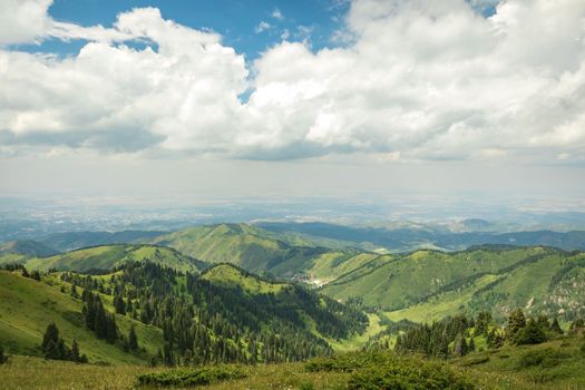 Summer landscape in the Almaty mountains in cloudy weather.