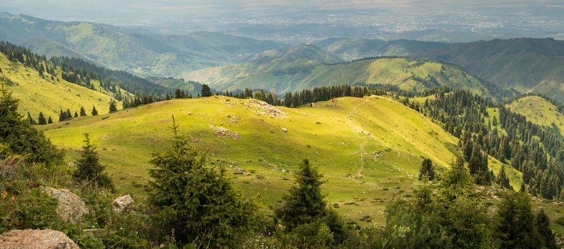 Mountain green valley in Almaty mountains, famous hiking trail in Kazakhstan