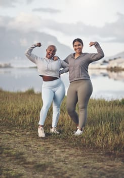 We hold each other accountable. two young women flexing while out for a run