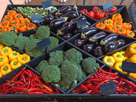 Top view: assortment of fresh organic vegetables on the counter of a grocery supermarket for healthy lifestyle. Veganism