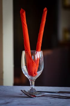 Unique Water Glass on the table at a restaurant, Restaurant drink water glass with red decoration, selective focus, blur background
