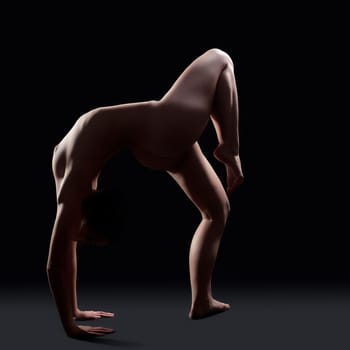 Nude acrobatic woman posing in studio