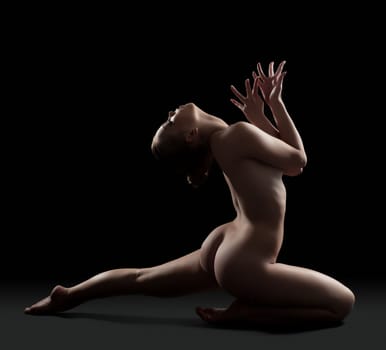 Sexy nude woman gymnast posing in studio