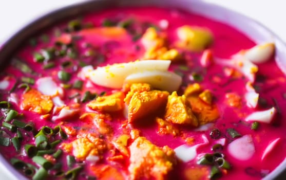 Cold beetroot soup with boiled eggs and greenery