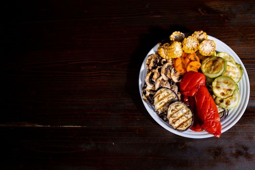 Tasty grilled vegetables on pan on dark background. Healthy food