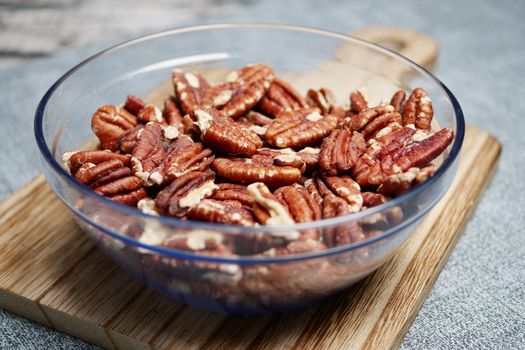 Tasty pecan-nut in a bowl on table