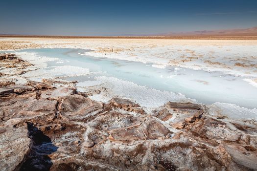 Salt lake, volcanic landscape at sunrise, Atacama, Chile border with Bolivia