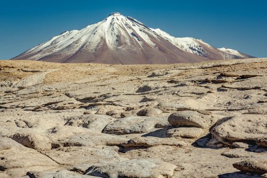 Dramatic volcanic landscape in Piedras Rojas at sunny day, Atacama Desert, Chile