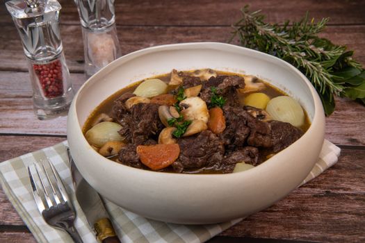 Beef bourguignon recipe, beef stew with wine sauce and vegetables