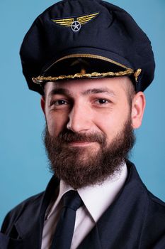 Aircraft captain wearing uniform and hat portrait