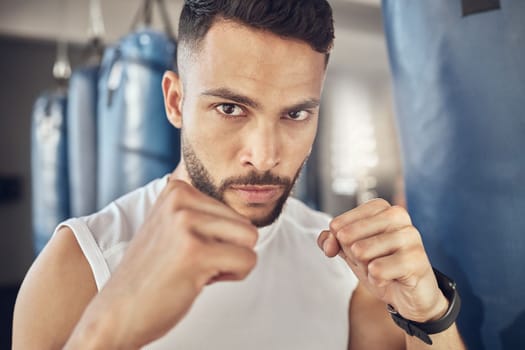 Closeup on face of boxer ready to punch. Portrait of mma fighter ready for boxing workout. Bodybuilder boxing in the. gym. Strong athlete ready to jab and punch in the gym.