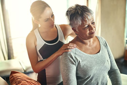 One tight muscle can have a dramatic affect. a senior woman being treated by a physiotherapist.
