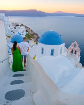Couple on vacation in Santorini Greece during summer at a Greek village