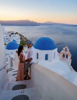 Couple on vacation in Santorini Greece during summer at a Greek village