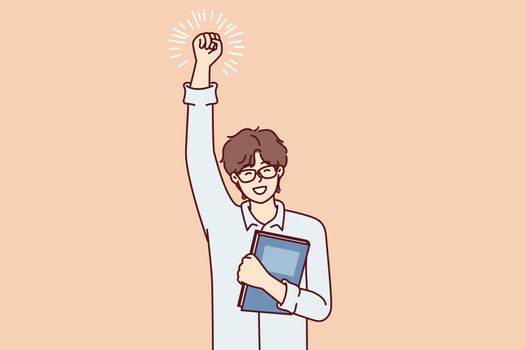 Joyful guy student with textbook in hand makes winning gesture after winning olympiad. Vector image