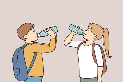 Children drinking fresh water from bottles