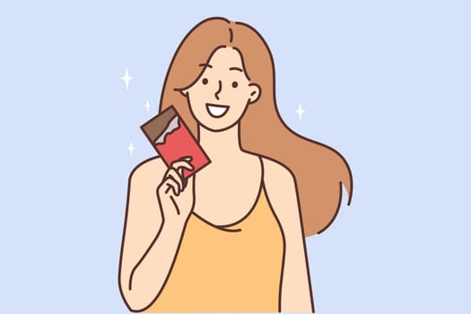 Smiling girl hold chocolate bar in hands