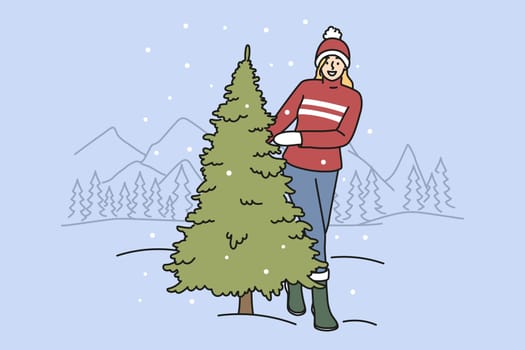 Smiling woman choose fir tree for New Year