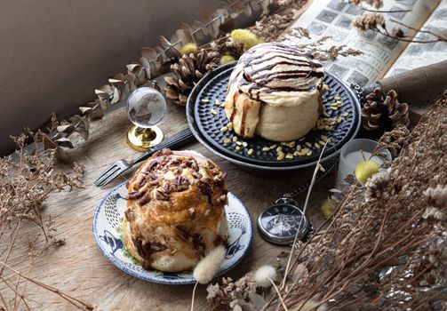 Caramel Pecanbon topped with caramel frosting and pecans and Cinnamon roll topped with rich cream cheese frosting.