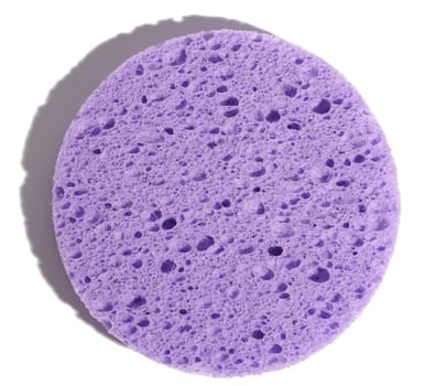Round purple makeup sponge on a white isolated background, top view