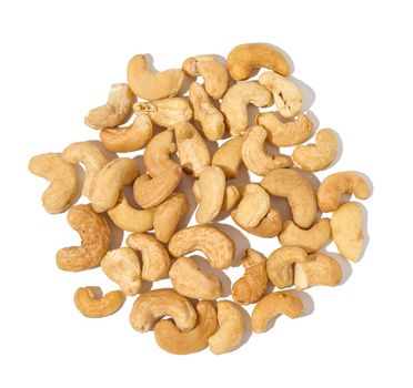 Heap of roasted cashew nut on white isolated background