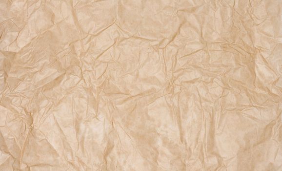 Texture of brown crumpled craft paper, full frame