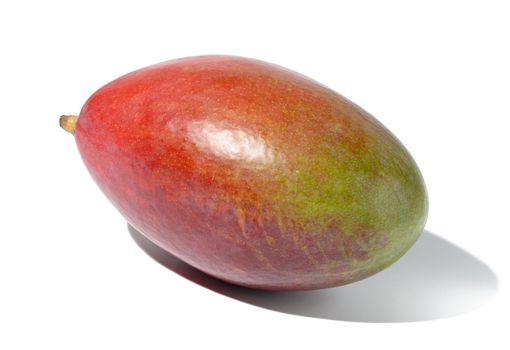 Whole ripe mango on a white isolated background