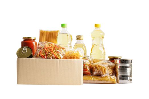 Foodstuffs in donation box isolated on white background with clipping path for volunteer to help people.