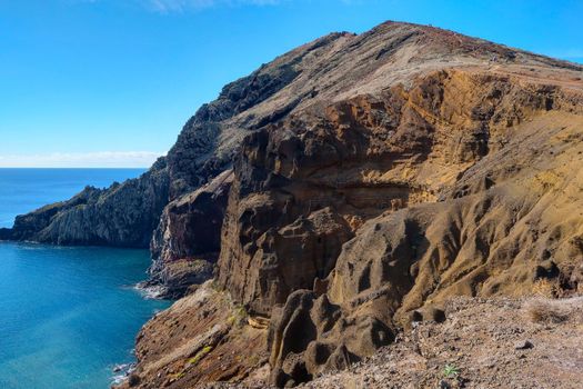 View of the slope of the island in the Atlantic Ocean. Volcanic rocks.