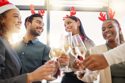 Toasting to more success. a group of businesspeople celebrating during a Christmas party at work.