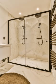 a large shower with a glass door in a bathroom