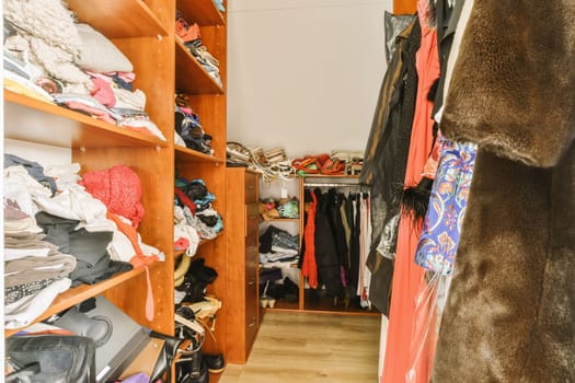 a room filled with clothes and a closet