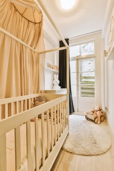 a nursery with a crib and a window with curtains