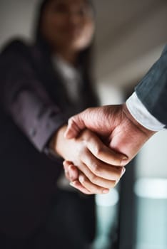I can agree to your terms. two unrecognizable businesspeople shaking hands in an office.