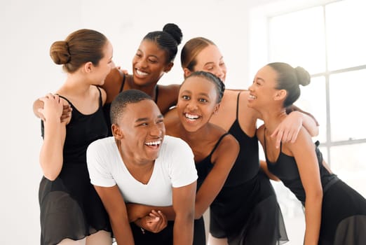 To fall in love with ourselves. a group of ballet dancers laughing together.