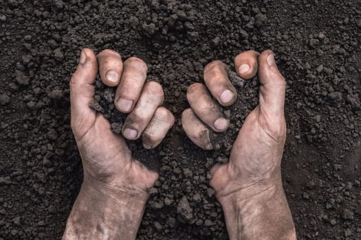 Handful of dirt hands holding soil hands touch the ground. Farmer hands full of soil field organic earth ground. Fertile soil field agriculture concept. Save the earth day earth save environment day