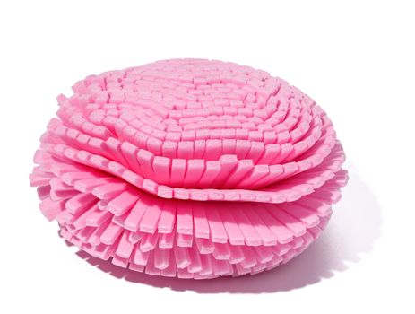 Pink washcloth on a white isolated background