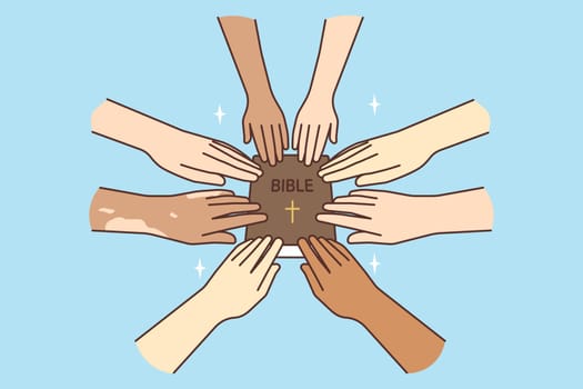 A multinational group holding a Bible