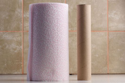 Soft white paper towel on a white table, disposable kitchen towel