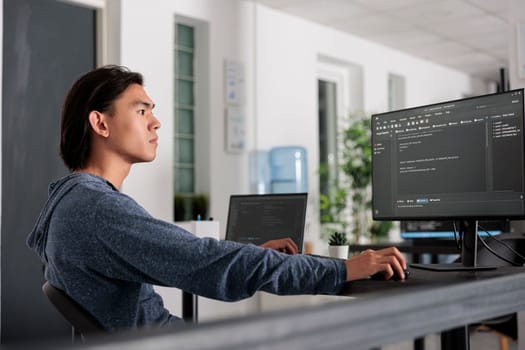 It engineer using programming computer to write html code on terminal window